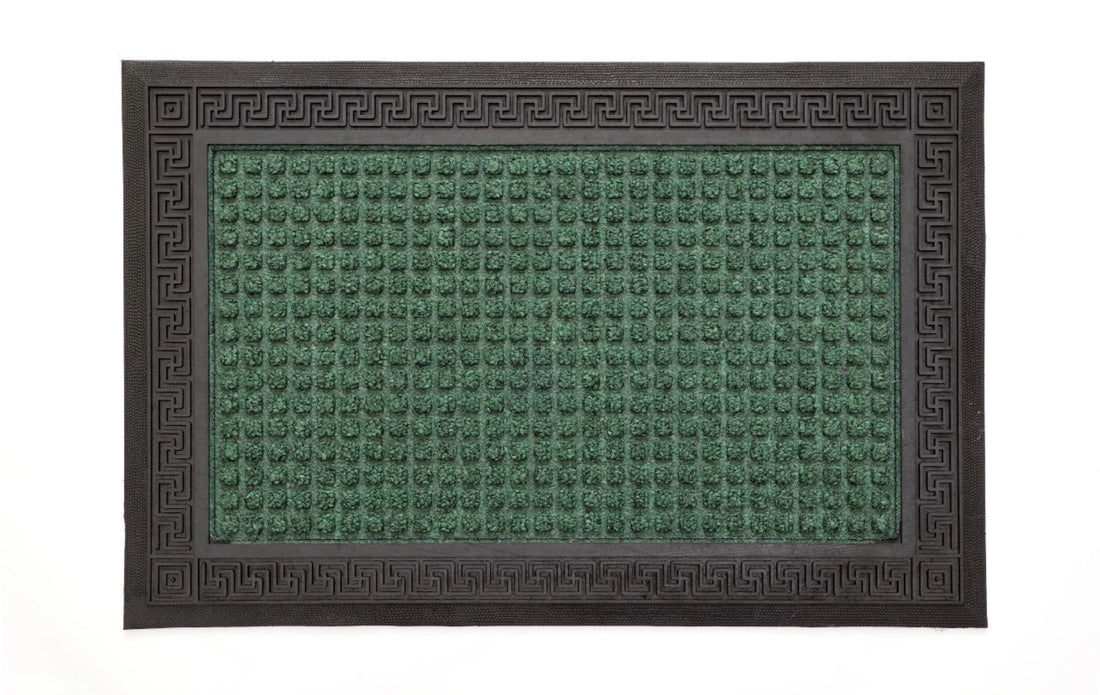
                      
                        A rectangular green doormat with an anti-slip design and a geometric pattern.
                      
                    
