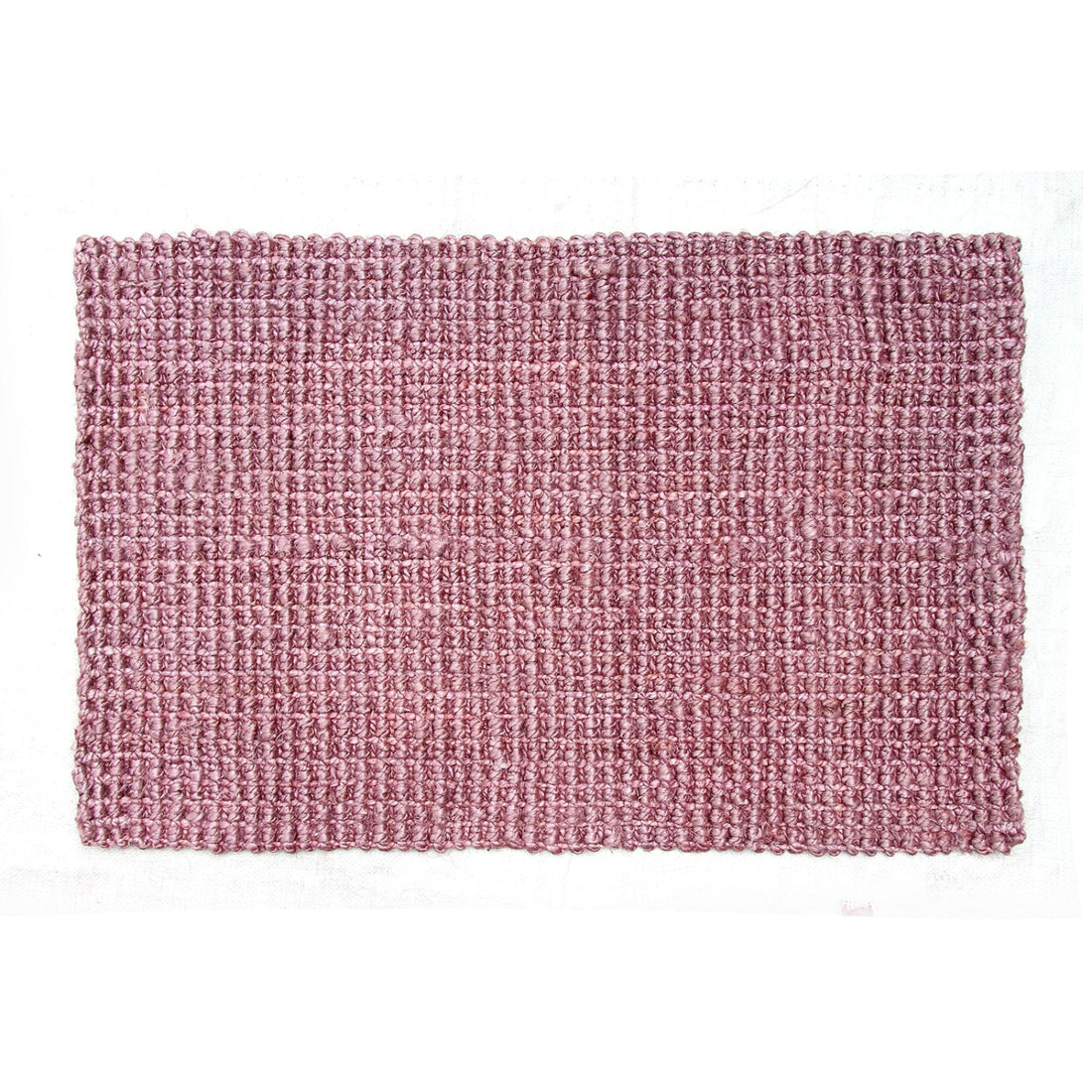 Pink textured jute mat on a white background